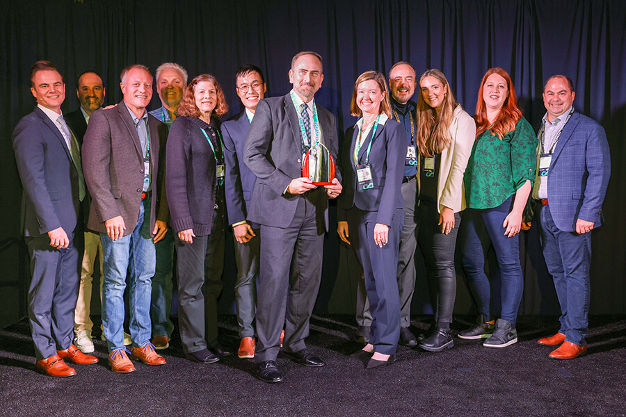 ATA Engineering team receiving award on stage.